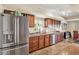 Bright kitchen features stainless steel appliances, tile floors, wood cabinets, and ample counter space at 4101 Hollowtrail Dr, Tampa, FL 33624