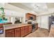 Well-equipped kitchen featuring stainless steel appliances and wood cabinets with stone countertops at 4101 Hollowtrail Dr, Tampa, FL 33624