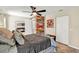 Main bedroom showcases wood accents, a ceiling fan, and a cozy ambiance at 4101 Hollowtrail Dr, Tampa, FL 33624