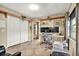 Bright office with natural light, dual monitors, wood shelving, and ample storage at 4101 Hollowtrail Dr, Tampa, FL 33624