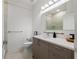 Bright bathroom featuring a modern vanity with quartz countertop and glass shower at 4106 N Thatcher, Tampa, FL 33614