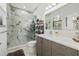 Stylish bathroom with modern vanity, marble shower, and glass door at 4106 N Thatcher, Tampa, FL 33614