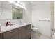 Bright bathroom featuring a modern vanity with quartz countertop and glass shower at 4106 N Thatcher, Tampa, FL 33614