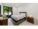 Neutral bedroom featuring a sliding door, a gray bed, and light colored tile floors at 4106 N Thatcher, Tampa, FL 33614