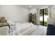 Modern bedroom featuring a bed, an open closet, and a large glass door to the outside at 4106 N Thatcher, Tampa, FL 33614