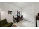 Bright office/bedroom with two work stations, white closet doors, and light colored tile floors at 4106 N Thatcher, Tampa, FL 33614
