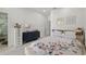 A bright bedroom with a bed, dressers, marble floors, and bright natural light at 4106 N Thatcher, Tampa, FL 33614