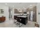 Modern kitchen features grey cabinets, marble countertops and stainless steel appliances at 4106 N Thatcher, Tampa, FL 33614