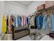 Walk-in closet with ample hanging space, wire shelves, and a bench at 4106 N Thatcher, Tampa, FL 33614