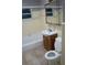 Bathroom features a tub, toilet and vanity with sink and mirror at 4114 E Sewaha St, Tampa, FL 33617