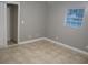 Serene bedroom with a window, a closet, neutral walls, and tile flooring, creating a cozy and peaceful retreat at 4114 E Sewaha St, Tampa, FL 33617