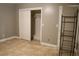 Bedroom with neutral walls, closet with sliding doors, and tile flooring at 4114 E Sewaha St, Tampa, FL 33617