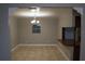 Bright dining room with decorative lighting, neutral walls, and tile floors, conveniently located next to the kitchen at 4114 E Sewaha St, Tampa, FL 33617