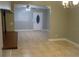 Light-filled dining room with tile floors, a connection to a living area, and a view of the front entry at 4114 E Sewaha St, Tampa, FL 33617
