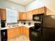 Kitchen featuring stainless steel appliances, light wood cabinets and a tile backsplash at 4114 E Sewaha St, Tampa, FL 33617