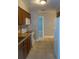 Functional kitchen with white appliances and warm brown cabinetry, offering ample storage and counter space at 4114 E Sewaha St, Tampa, FL 33617