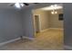 Cozy living room shows tile flooring and easy access to the dining room and front door, perfect for entertaining at 4114 E Sewaha St, Tampa, FL 33617