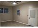 Living room featuring several windows, and a ceiling fan at 4114 E Sewaha St, Tampa, FL 33617
