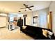 Living room and kitchen combo featuring tile floors, stainless steel appliances and modern furnishings at 4114 E Sewaha St, Tampa, FL 33617