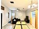 Living room featuring tile floors, ceiling fan, and modern furnishings at 4114 E Sewaha St, Tampa, FL 33617