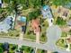 Aerial view of a residential neighborhood featuring houses with pools and well-maintained yards at 4317 74Th E Ave, Sarasota, FL 34243
