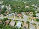 An aerial view of a neighborhood showcasing lush greenery and well-maintained homes and cul-de-sac at 4317 74Th E Ave, Sarasota, FL 34243