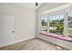 Sun-filled room featuring a large bay window with a comfortable seating area and wood-look floors at 4317 74Th E Ave, Sarasota, FL 34243