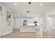 Spacious open kitchen featuring stainless steel appliances, a kitchen island, and wood flooring at 4317 74Th E Ave, Sarasota, FL 34243