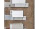 Birds eye view of the home with a white roof and a long driveway at 4801 Blanco Dr, Zephyrhills, FL 33541