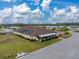 Exterior shot of the community clubhouse with solar panels and a beautiful inground pool at 4801 Blanco Dr, Zephyrhills, FL 33541