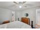 Inviting bedroom featuring a wood bed, and a door leading to the bathroom for added convenience at 4801 Blanco Dr, Zephyrhills, FL 33541