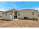 Back yard of house with A/C unit and a grill at 4801 Blanco Dr, Zephyrhills, FL 33541