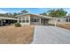 Inviting home with covered parking and manicured front yard ready for new owners at 4801 Blanco Dr, Zephyrhills, FL 33541