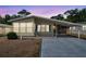 Charming single-story home featuring a covered carport and well-maintained landscaping at 4801 Blanco Dr, Zephyrhills, FL 33541
