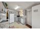 Bright kitchen featuring updated cabinets and appliances, offering style and functionality at 4801 Blanco Dr, Zephyrhills, FL 33541