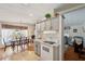 Open kitchen and dining area with modern fixtures, updated appliances and fixtures and ample lighting at 4801 Blanco Dr, Zephyrhills, FL 33541