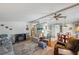 Bright living area with ceiling fan, fireplace, and dining area at 4801 Blanco Dr, Zephyrhills, FL 33541