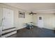 Enclosed patio with ceiling fan and stairs to the outside at 4801 Blanco Dr, Zephyrhills, FL 33541