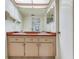 Bathroom featuring double sinks, white cabinets, and large mirrors at 4802 W Dryad St, Tampa, FL 33629