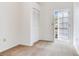 Bedroom featuring neutral carpet, a closet, and a glass door leading to the outside at 4802 W Dryad St, Tampa, FL 33629