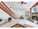 Living Room with stone fireplace, wood staircase and wood accents at 4802 W Dryad St, Tampa, FL 33629