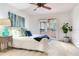 Bright primary bedroom featuring neutral walls, plush carpet, and sliding door to outdoor at 4802 W Dryad St, Tampa, FL 33629