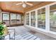 Cozy screened porch with French doors leading to the dining room at 4802 W Dryad St, Tampa, FL 33629