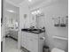 Well-lit bathroom featuring a vanity with granite countertop, a mirror, and updated fixtures at 4900 Brittany S Dr # 808, St Petersburg, FL 33715