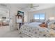 Comfortable bedroom with a desk and workstation, offering views of the beautiful scenery outside at 4900 Brittany S Dr # 808, St Petersburg, FL 33715