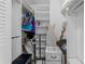 Spacious closet with built-in shelving and hanging rods at 4900 Brittany S Dr # 808, St Petersburg, FL 33715