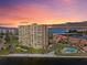 Stunning sunset view of the high-rise condo overlooking the bay and community pool at 4900 Brittany S Dr # 808, St Petersburg, FL 33715