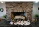 Charming brick fireplace adorned with Christmas decorations in the living room at 4900 Brittany S Dr # 808, St Petersburg, FL 33715