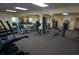 Bright community gym featuring cardio machines, weightlifting equipment, and mirrored walls at 4900 Brittany S Dr # 808, St Petersburg, FL 33715