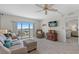 Inviting living room with comfortable seating, a mounted TV, and balcony access offering beautiful views at 4900 Brittany S Dr # 808, St Petersburg, FL 33715